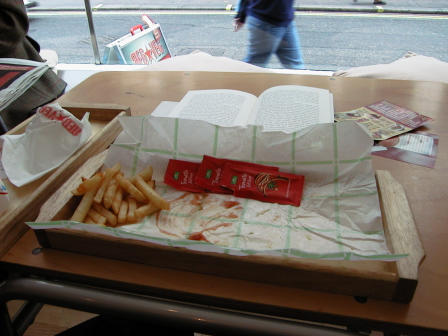 Three packets of ketchup have been consumed, but fries still remain
