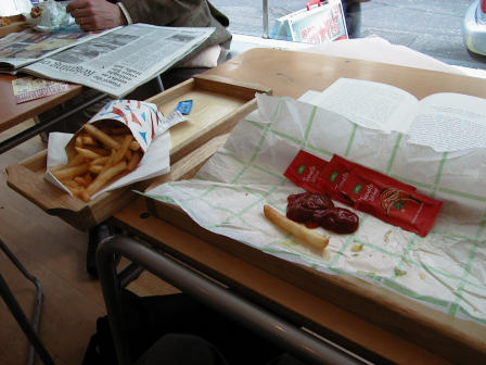 Three packets-worth of ketchup await use